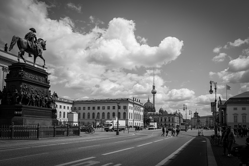many people bustle on the famous street Unter den Linden in Berlin
