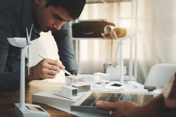 istock Engineers specializing in design and computing to power pure energy in the modern home. Point to roof area to install solar panels. Save electricity in the future with solar energy. 1401993175
