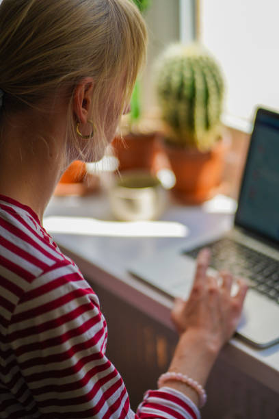 istock Closeup of young woman writing on her computer 1401996318