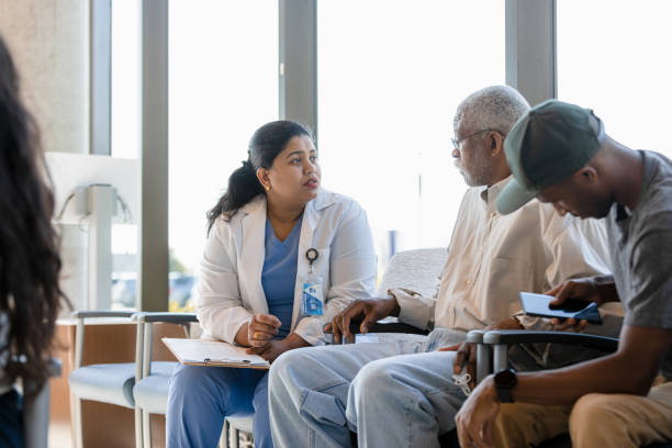 istock Doctor talks to father while son checks phone 1401996468