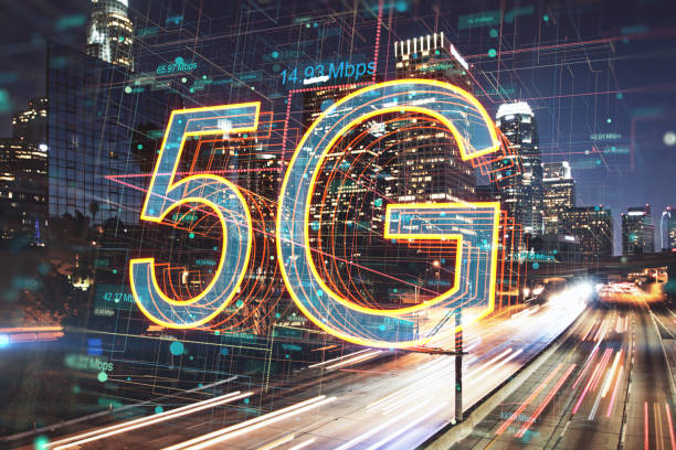 istock 5G network internet mobile wireless business concept with bright digital symbols and speed indicators on illuminated night megapolis city background, double exposure 1401996487
