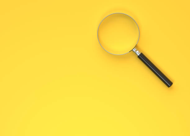 istock Magnifying glass on a yellow background 1401996520