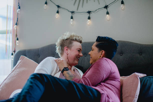 istock Lesbian Couple Cozy Relaxing on their Bed 1401997521