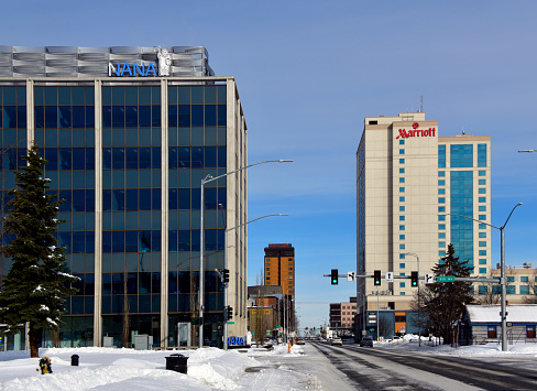 Anchorage, Alaska, USA: NANA Regional Corporation and Anchorage Marriott, a Columbia Sussex Hotel - looking north along I Street - winter.