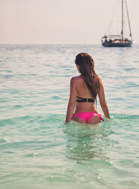 istock Beautiful Young Girl Enjoying on The Beach 1402002661