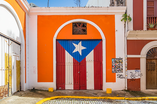 Puerto Rican Flag painted on a gate in Old San Juan, Puerto Rico on a sunny day.