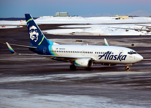 Anchorage, Alaska, USA: starboard view of Alaska Airlines Boeing 737-790(WL) N613AS, MSN 30163 - snow and ice on the tarmac at Ted Stevens Anchorage International Airport.