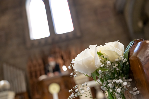I photographed the flowers displayed in the attendance seats of the church.