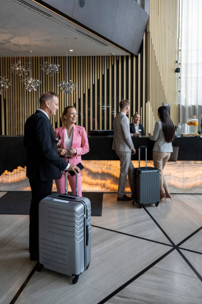 istock Four business persons seen in the hotel lobby 1402012582