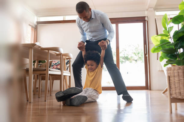 istock African American Father and his son playing on the floor 1402012755