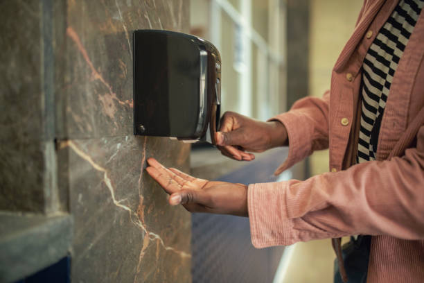 istock An unrecognizable man pours hand sanitizer. 1402021397