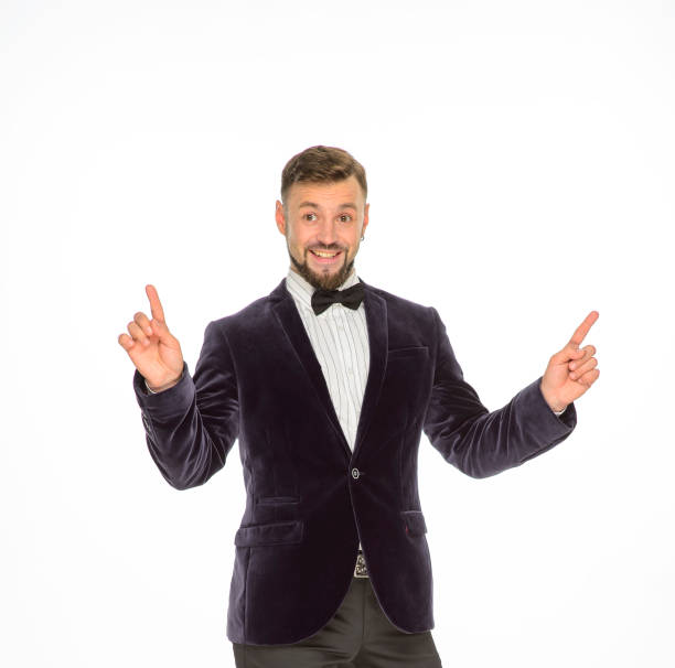 istock cheerful man in a jacket with a bow tie posing isolated on a light background 1402022646