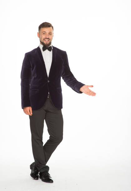 istock cheerful man in a jacket with a bow tie posing isolated on a light background 1402022649
