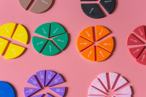 istock Multicolored fractions, on pink background. Interesting, fun math for kids. Education, back to school concept 1402023146