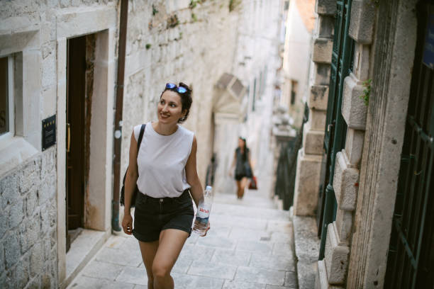 istock young woman sightseeing on vacation 1402024143