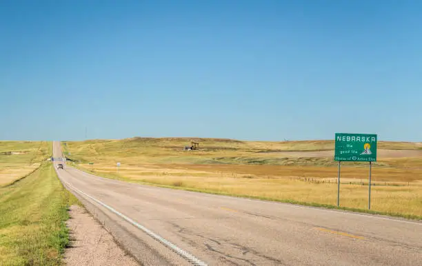 Nebraska , the good life, home of Arbor Day - roadside welcome sign at state border with Colorado, late summer scenery