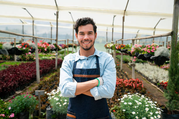 istock Happy man working at a garden center 1402037190
