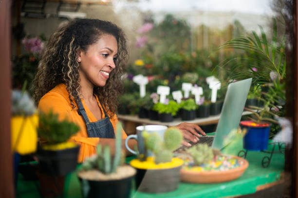 istock Florist working in her small business using a laptop 1402037195