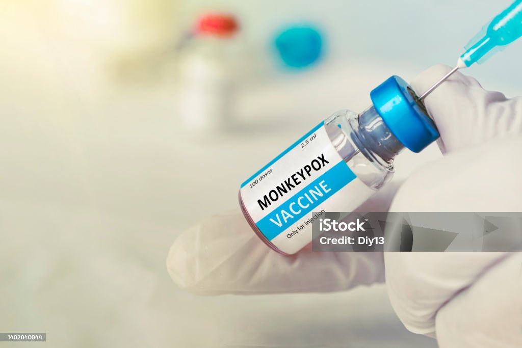 Vaccination for booster shot for Smallpox and Monkeypox MPXV . Doctor with vial of roses vaccine for Monkeypox disease Vaccination for booster shot for Smallpox Monkeypox MPXV . Doctor with vial of roses vaccine for Monkeypox disease Mpox Stock Photo