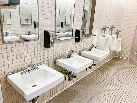 A small modern bathroom with a toilet and a sink.