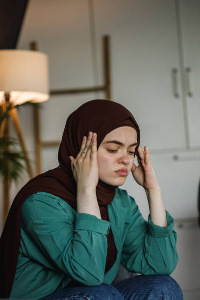 istock Battling anxiety and negative thoughts, causing a painful migraine 1402045672