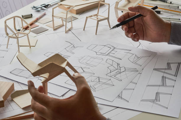 istock Designer sketching drawing design development product plan draft chair armchair Wingback Interior furniture prototype manufacturing production. designer studio concept . 1402046533
