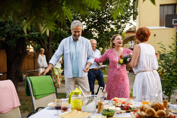 istock Girlfriends about to hug when meeting for a celebratory dinner party 1402048222