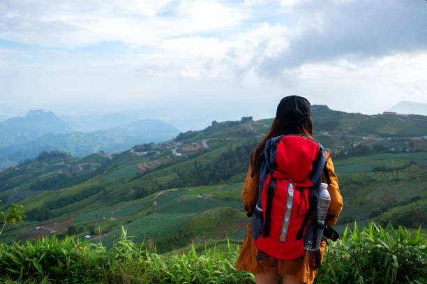 istock Hiker with backpack relaxing young woman hiking holiday 1402048426