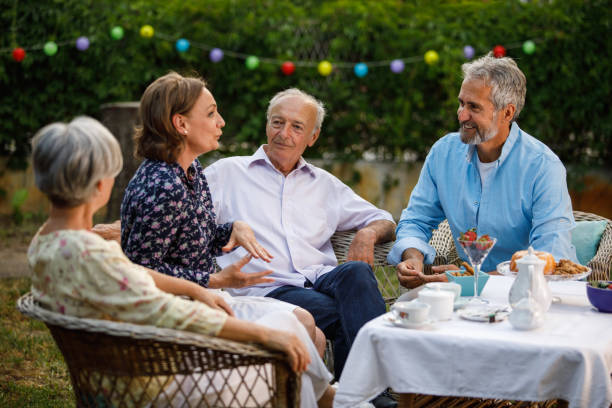istock Four friends bonding and chatting during afternoon tea in the back yard 1402049054