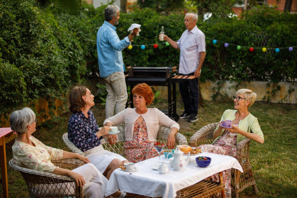 istock Elderly friends hanging out in the back yard, chatting and bonding 1402049095