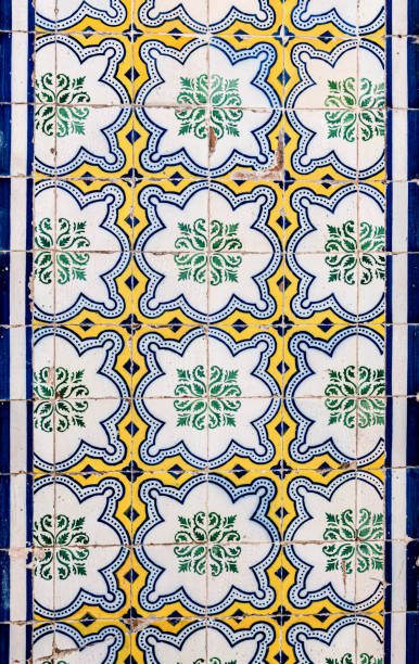 Close-up of vibrant blue and white geometric patterned ceramic tiles, showcasing the beauty of traditional portuguese azulejo craftsmanship in porto