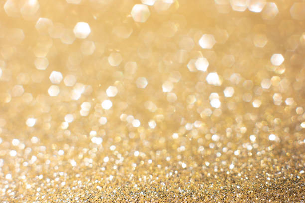 istock Gold glittery bright shimmering background 1402052749