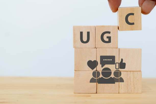 istock User-generated content concept.(UGC) Online marketing concept. Customer create content on social media . Close up hand put  wooden cube with 