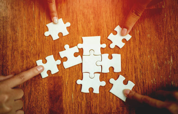 istock teamwork unity and cooperation concept hand holding jigsaw close-up piece of hand that connect puzzle connected to each other business solution Success Concepts and Strategies 1402055735