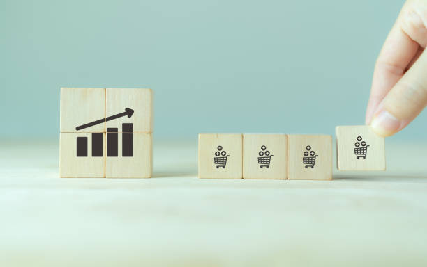 istock Growth of sales, average order value (AOV) concept. Strategy to get more money per oder. Increase sales in online store, e-commerce. Adding wooden cubes with sales growth on grey background. 1402055988