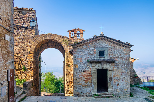 The Porta di San Felice with the nearby small Church of San Felice are among the medieval evidences of Volterra. In background the suggestive view opens on the upper Val di Cecina.