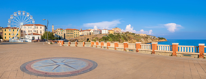 Compass rose in Piazza Bovio on the seafront of Piombino, important port and industrial center of Tuscany (3 shots stitched)
