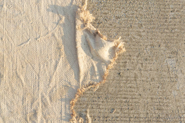 istock The light brown fabric texture on the concrete floor conveys abstract meaning. 1402057173