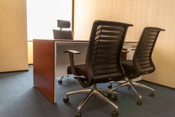 istock Office of a company manager with large windows, a computer table with black chair. 1402058055