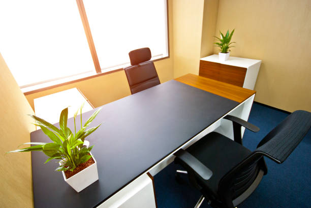 istock Office of a company manager with large windows, a computer table with black chair. 1402058700