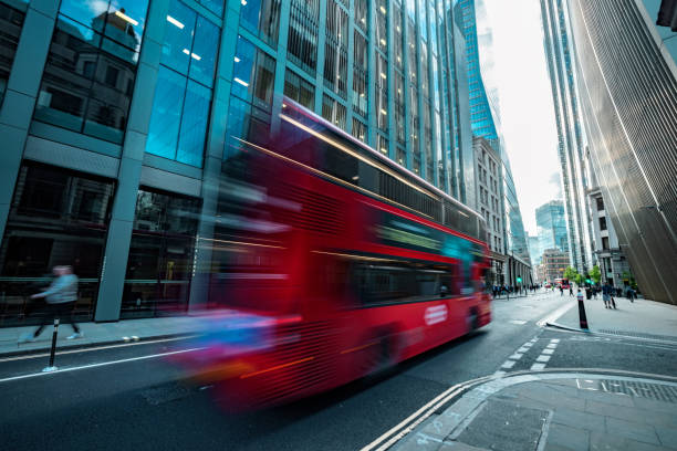istock Bus driving on the modern London streets 1402059525