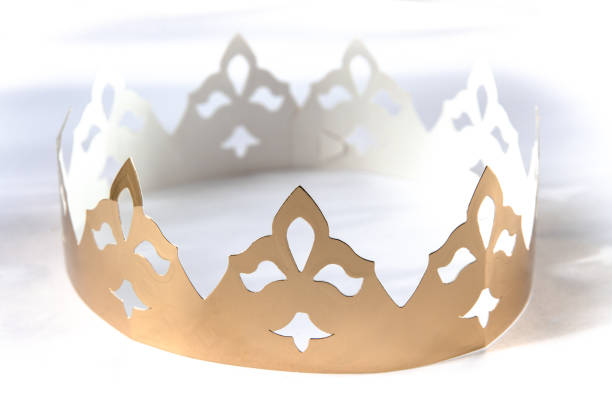 istock Gold paper king crown isolated on white 1402063404