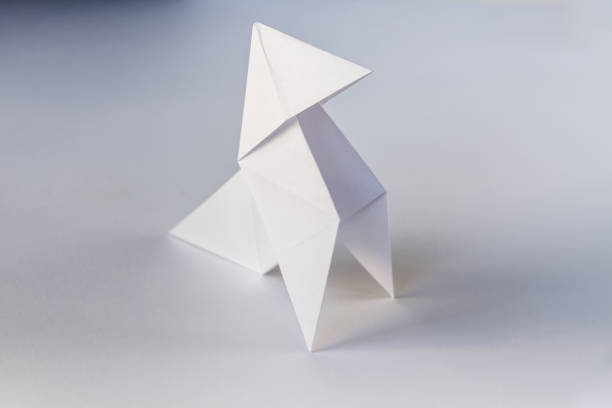 istock Paper hen origami isolated on a white background 1402063668