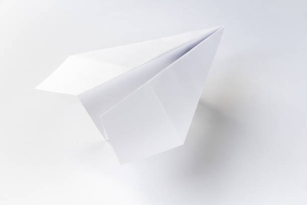 istock Paper plane origami isolated on a white background 1402063671