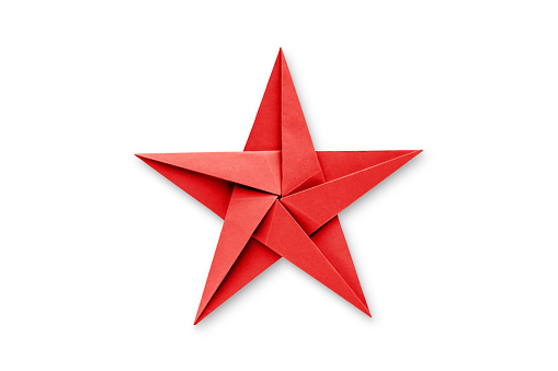 Red paper star origami isolated on a blank white background.