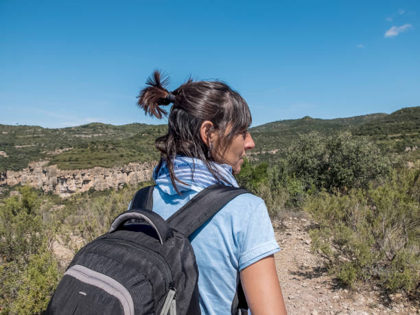 woman backpacker enjoying the view of nature