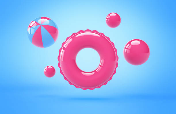 istock Inflatable pink swimming ring and beach balls on blue background 1402067057