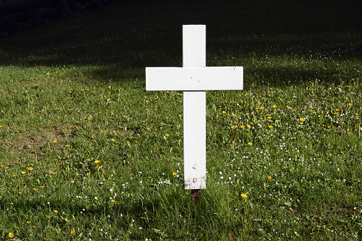 White wooden cemetery cross