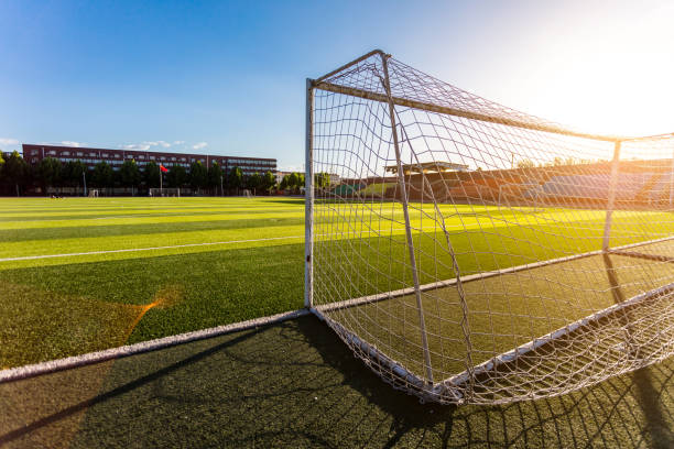 istock Close-up of soccer goal in sunlight 1402067366