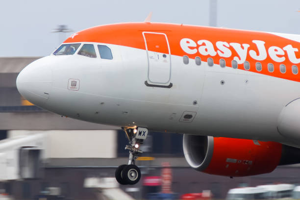 Easyjey fleet aircraft in orange and white.  These aircraft are typically Airbus A320.  London Stansted.